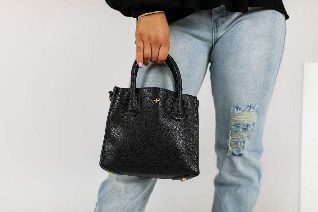a collection of modern bags most are eco friendly being made from recycled vegan leather in crossbody styeles and backpacks