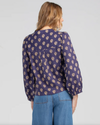 the amore shirt by boom shankar is a button up long sleeve top in a traditional black print pattern made ethically in india
