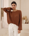 The Celeste Knit by Iris Maxi is a soft cotton sweater crafted in beautiful pointelle and cable knit pattern