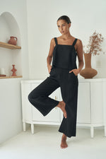 little lies jude linen pants have elastic back and zip and button closure with wide leg and pockets