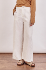 The Jude Linen pants by Little Lies are a wide leg linen pants in ivory with zip and button closure and side pockets 