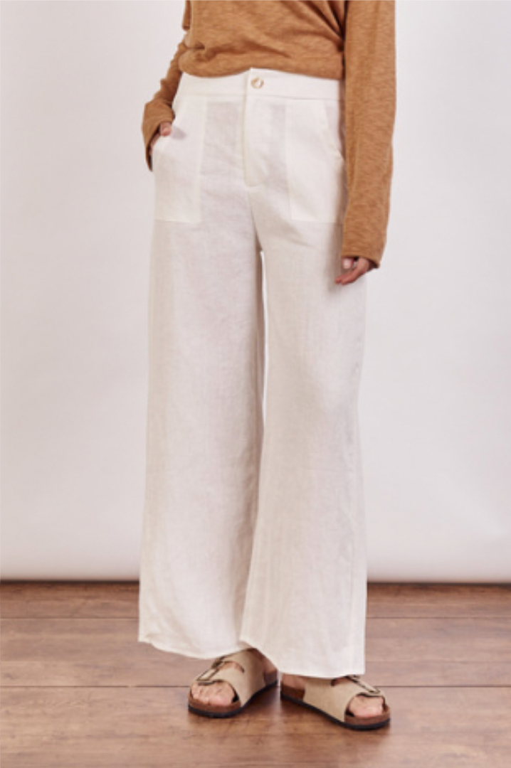 The Jude Linen pants by Little Lies are a wide leg linen pants in ivory with zip and button closure and side pockets 