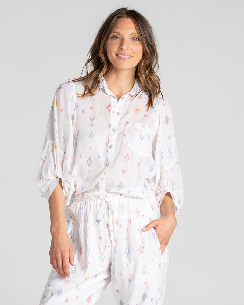 the pari shirt by boom shankar is a super silky soft cotton button up collared blouse with a small aztec print