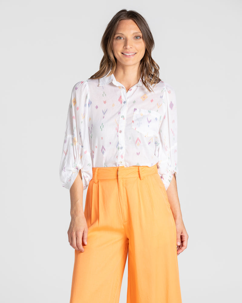 the pari shirt by boom shankar is a super silky soft cotton button up collared blouse with a small aztec print