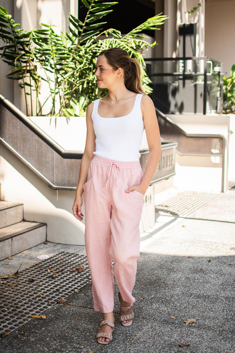 relaxed pink linen pants with an elastic waist and pockets