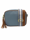 a light blue vegan leather cross body bag by zjoosh with tan contrast piping and straps