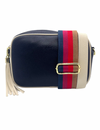 a navy blue vegan leather cross body bag by zjoosh with ecru contrast piping and straps