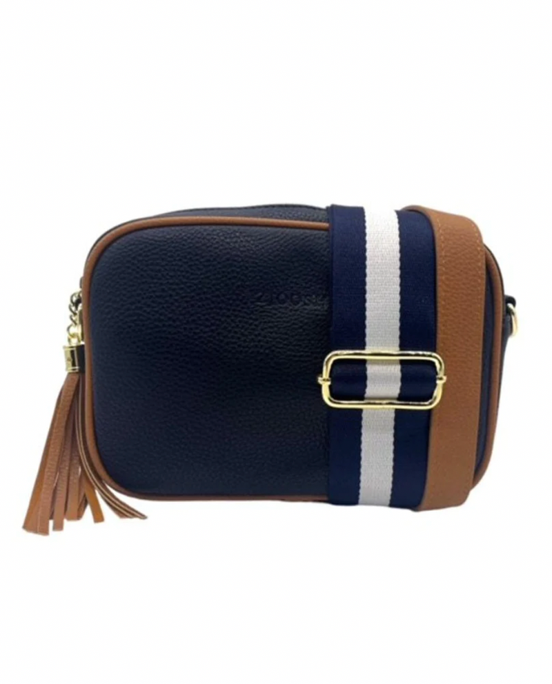 a navy blue vegan leather cross body bag by zjoosh with tan contrast piping and straps