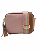 a pink vegan leather cross body bag by zjoosh with tan contrast piping and straps