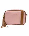 a pink vegan leather cross body bag by zjoosh with tan contrast piping and straps