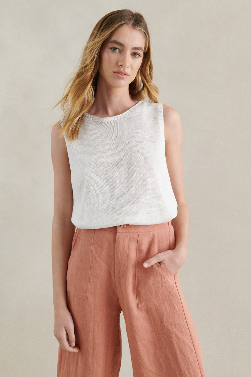 the spring tank by little lies is a white knitted sleeveles tank top