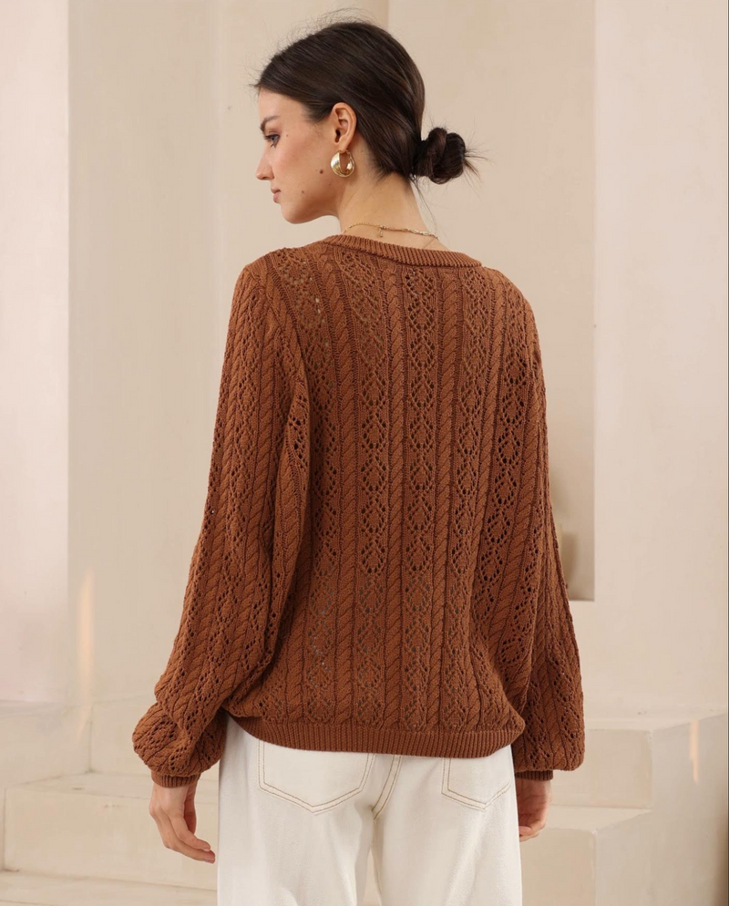 The Celeste Knit by Iris Maxi is a soft cotton sweater crafted in beautiful pointelle and cable knit pattern
