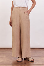 jude pants by little lies are a tan linen fitted pant with zipper and button closure and wide leg