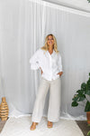 The Jude Linen pants by Little Lies are a wide leg linen pants in natural with zip and button closure and side pockets 