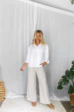 The Jude Linen pants by Little Lies are a wide leg linen pants in natural with zip and button closure and side pockets 