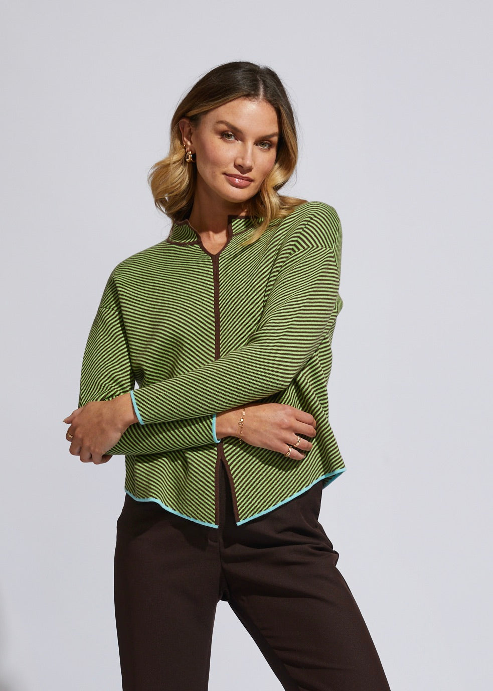 the neru collar jumper by ld and co is a knitted sweater in a chocolate brown and green diagnol knit pattern