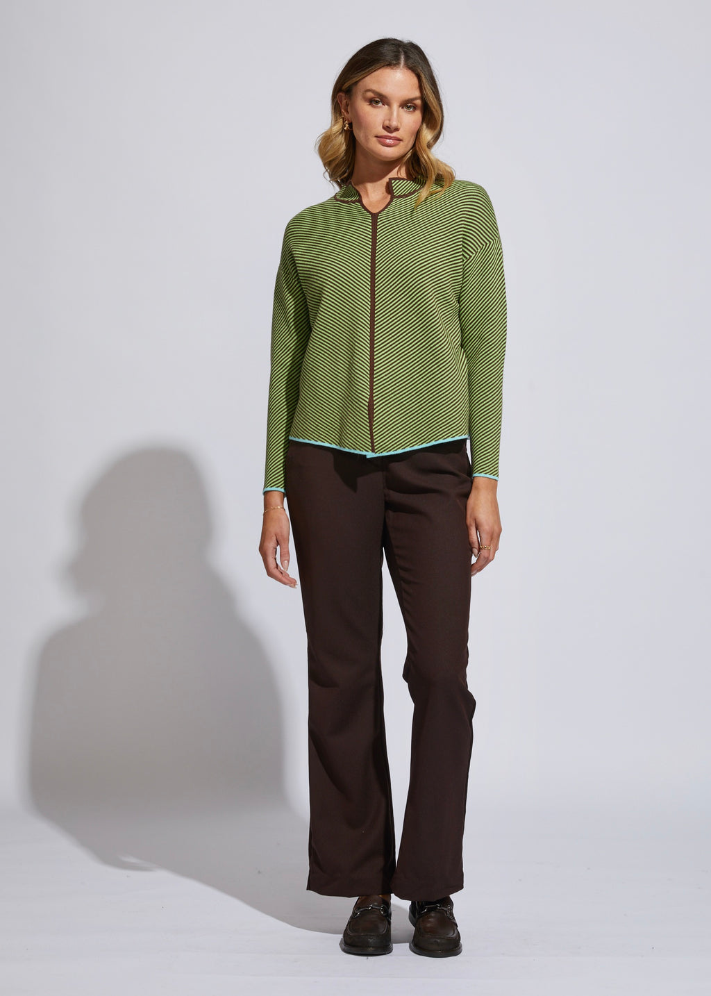 the neru collar jumper by ld and co is a knitted sweater in a chocolate brown and green diagnol knit pattern