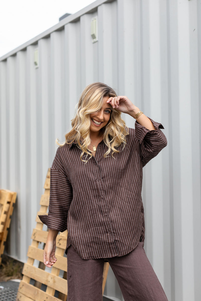 the orla stripe shirt from little lies is a chocolate and white pin stripe button up collared shirt