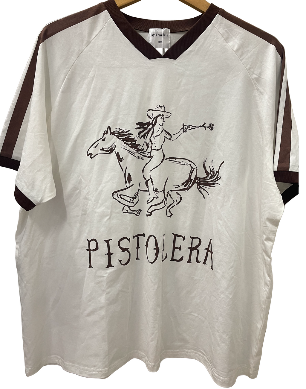 White shirt with cowboy graphic and 'Pistolera' tee by frankie