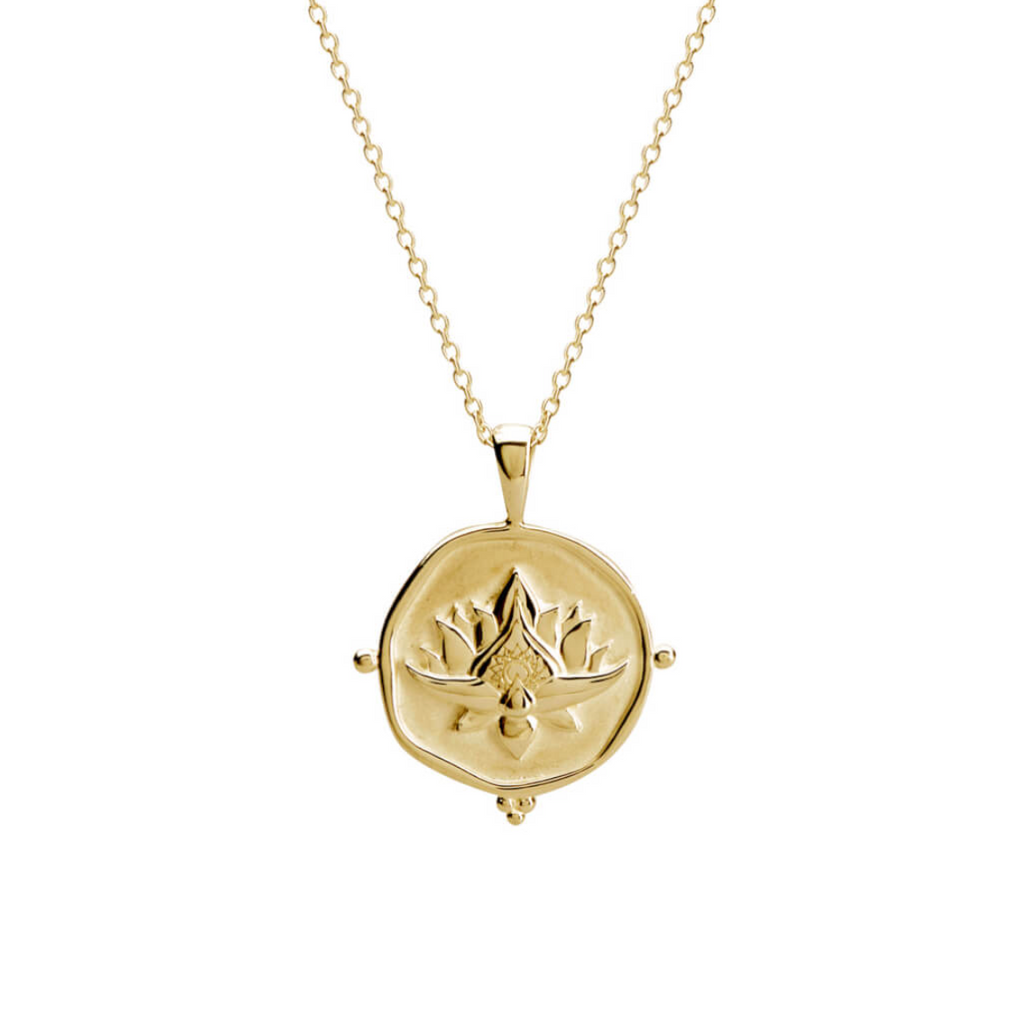 a 18 karat yellow gold plate necklace with a blooming lotus design pendant