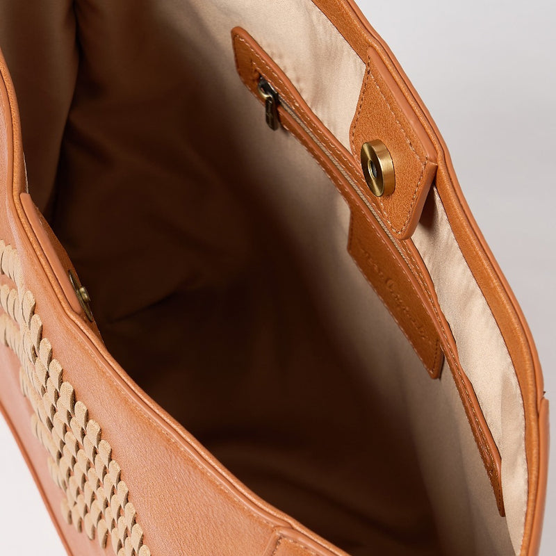 a vegan leather tan coloured shoulder bag with woven design on the front