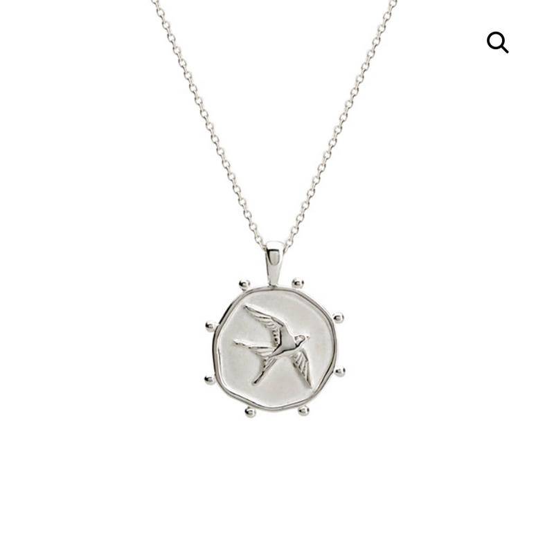 the freedom necklace by murkani is a sterling silver fine chain with a swallow pendant