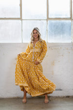 the Goa dress is a marigold yellow coloured cotton block print maxi dress with a long sleeve and border detail by Jipsi Cartel