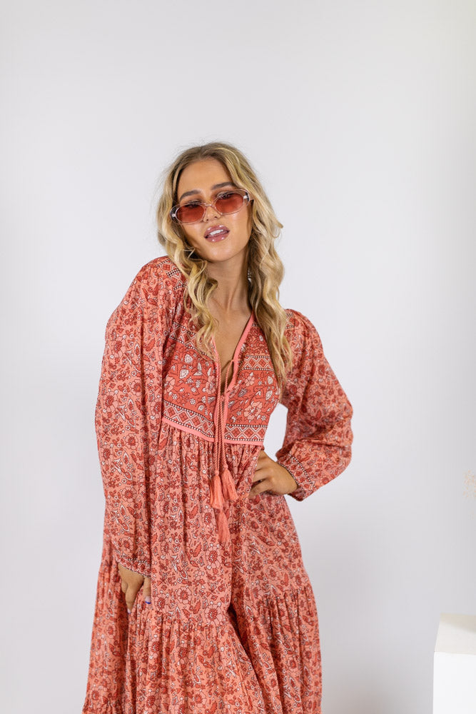 a 70's inspired vintage bohemian floral maxi dress made from rose pink cotton block print