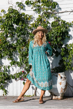 a turquoise floral long sleeve midi bohemian style dress by Jipsi Cartel