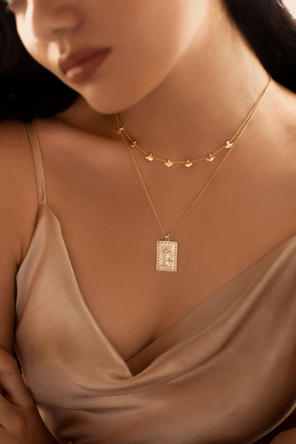 Murkani's 18 Karat yellow gold plated rectangle Into The Light Necklace.