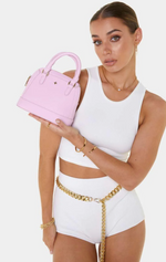 brielle is a vegan leather eco handbag by peta and jain in pink